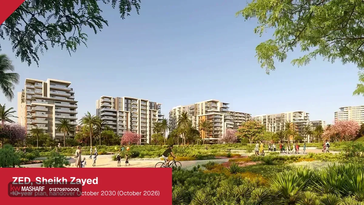 Landscaped park with paths and flowering trees, with white residential towers in the background