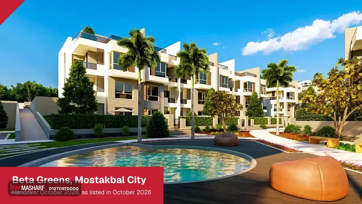Round pool with a sculptural seat in front of white townhouses and palm trees