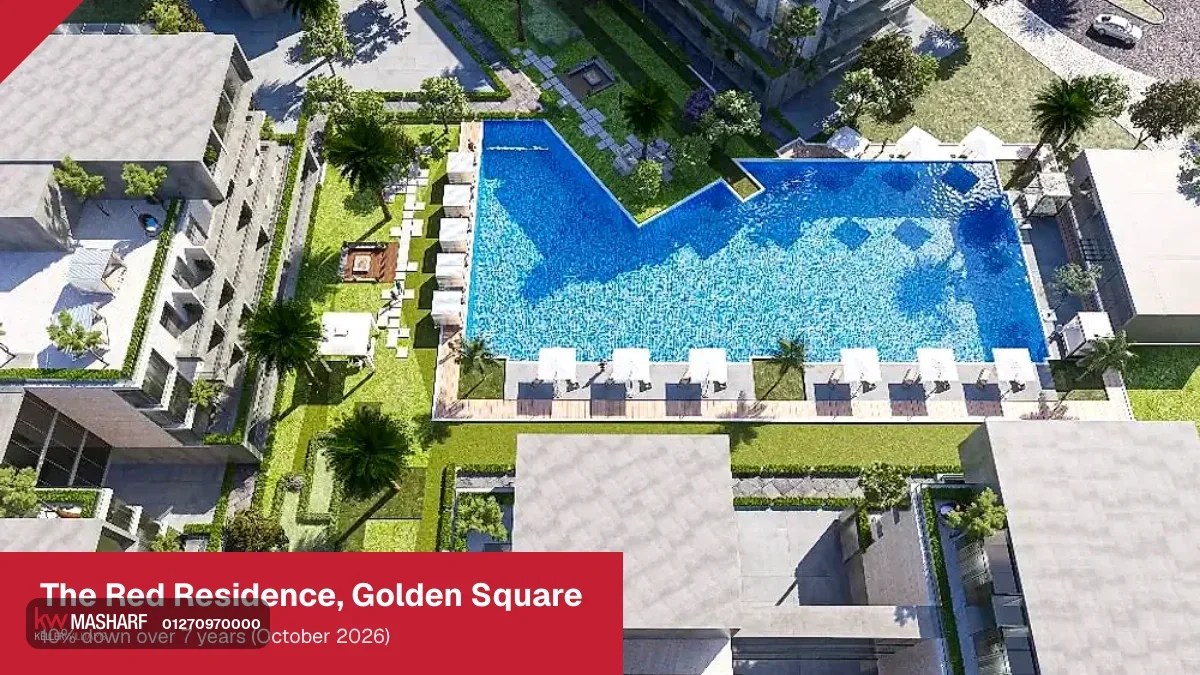 Aerial view of residential buildings arranged around a central pool and gardens